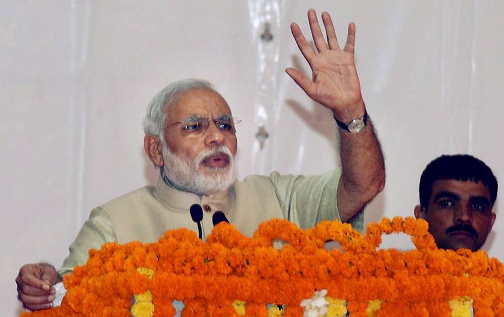 Prime Minister Narendra Modi addresses during the foundation stone laying ceremony of a trade facilitation centre for weavers in Varanasi.