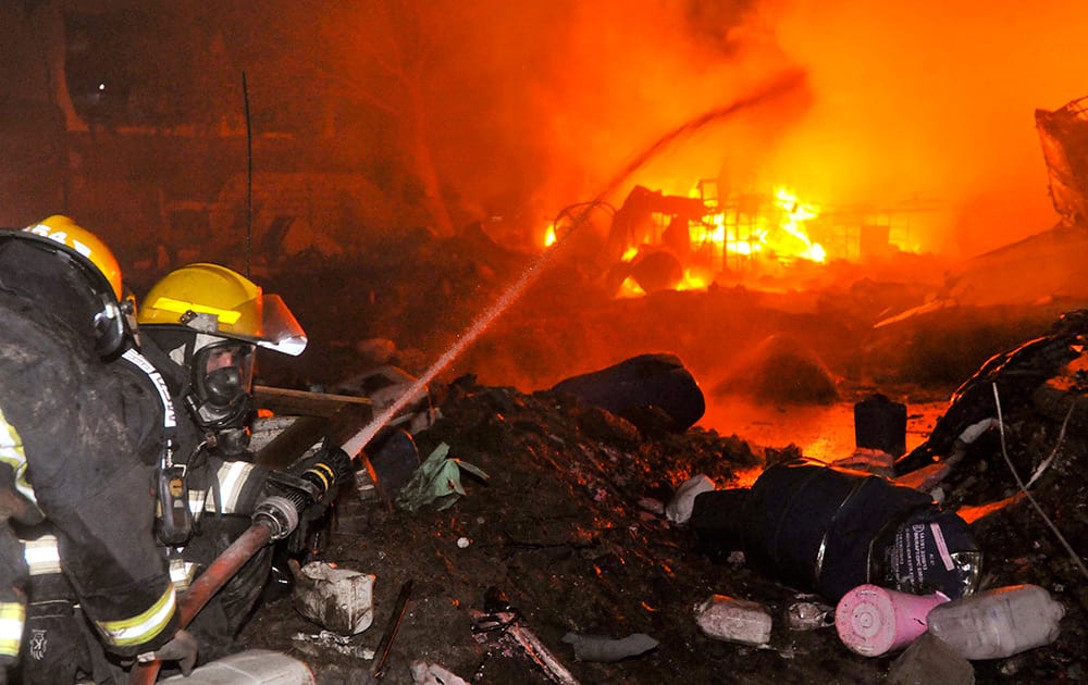 Firemen douse flames emerging from the Rigoni chemical factory in Cordoba, Argentina. According to the provincial Health Minister Francisco Fortuna, more than 60 people were injured due to the explosion at the chemical plant in the province of Cordoba, Thursday night.