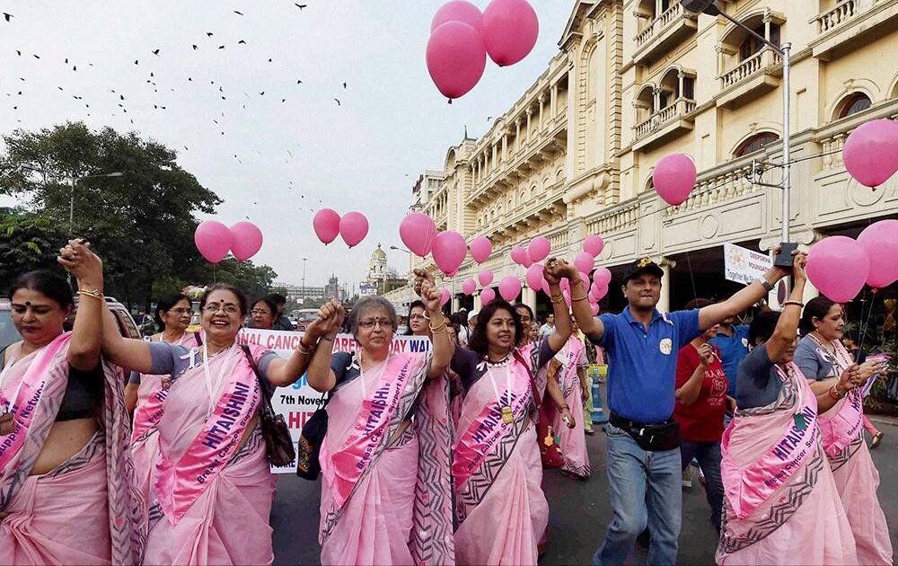 Women participate in a rally during National Breast Cancer Awareness Day in Kolkata.