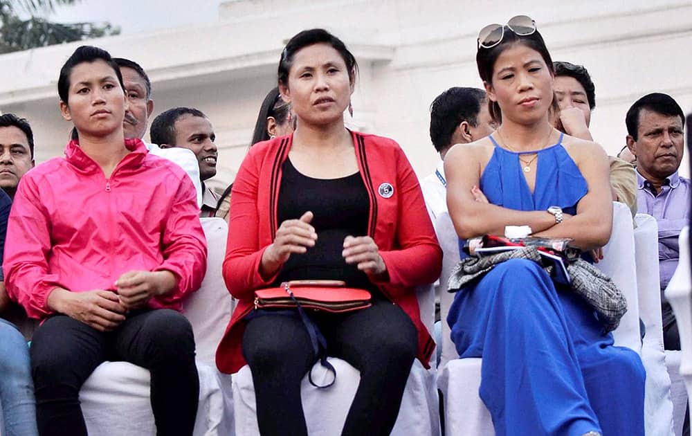 Boxers Mary Kom and L Sarita Devi during the North-East Festival in New Delhi.