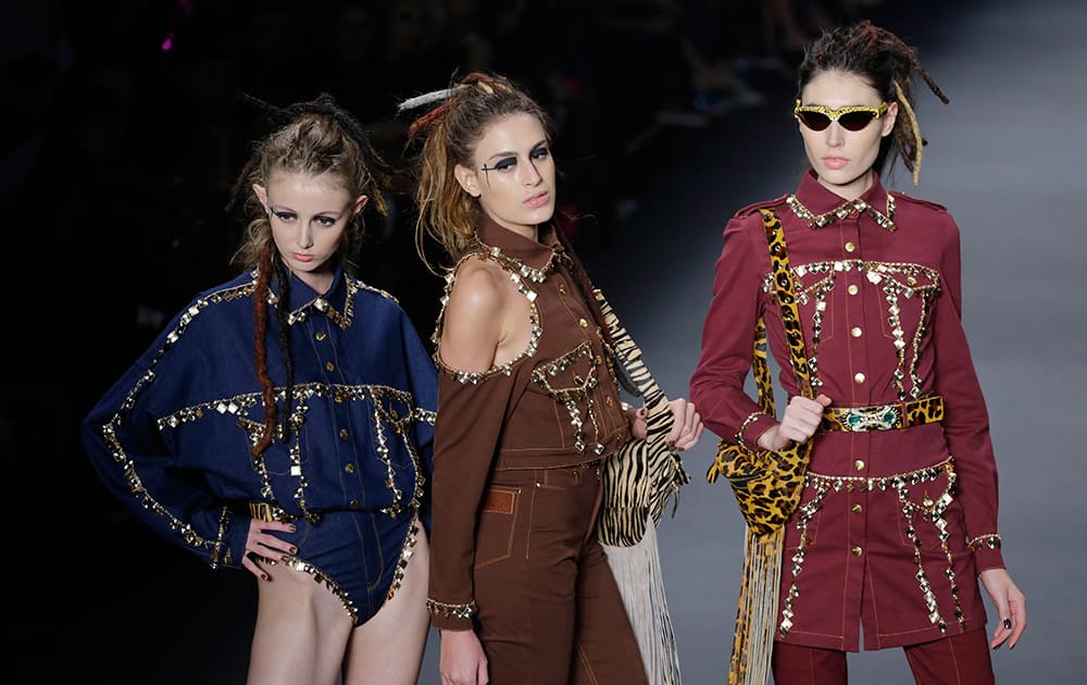 Models wear creations from the Amapo Winter collection during Sao Paulo Fashion Week in Sao Paulo, Brazil.