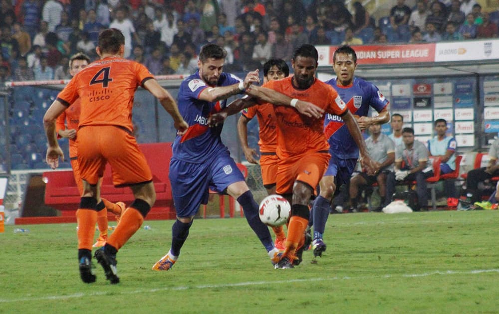 Mumbai City FC and Delhi Dynamos FC players in action during the Indian Super League match.