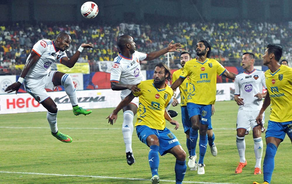 Kerala blasters FC (Yellow) and Goa FC (Blue) players in action during the ISL match in Kochi.