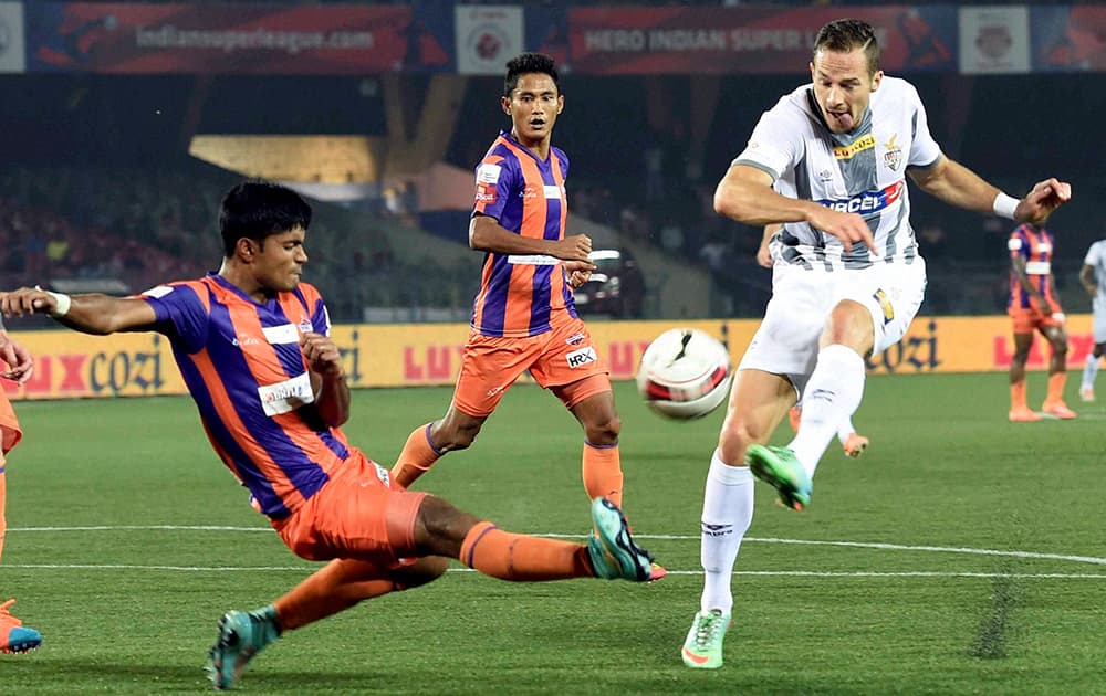 Atletico de Kolkata( white) and FC Pune City players in action during their ISL match in Kolkata.