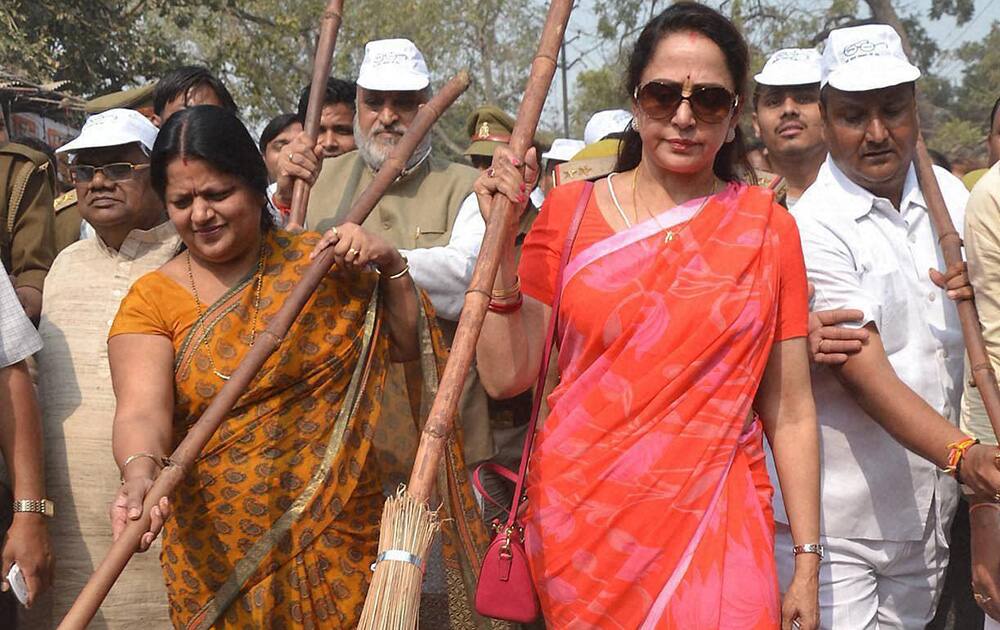 Bollywood Actress and BJP MP Hemamalini sweeps a road as she particaptes in Swachh Bharat Misson.
