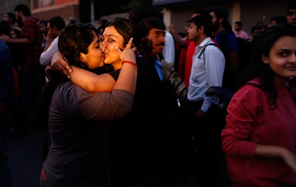Women kiss each other to express support to the 'Kiss of Love’ campaign near the Hindu right-wing Rashtriya Swayamsevak Sangh (RSS) headquarters in New Delhi.