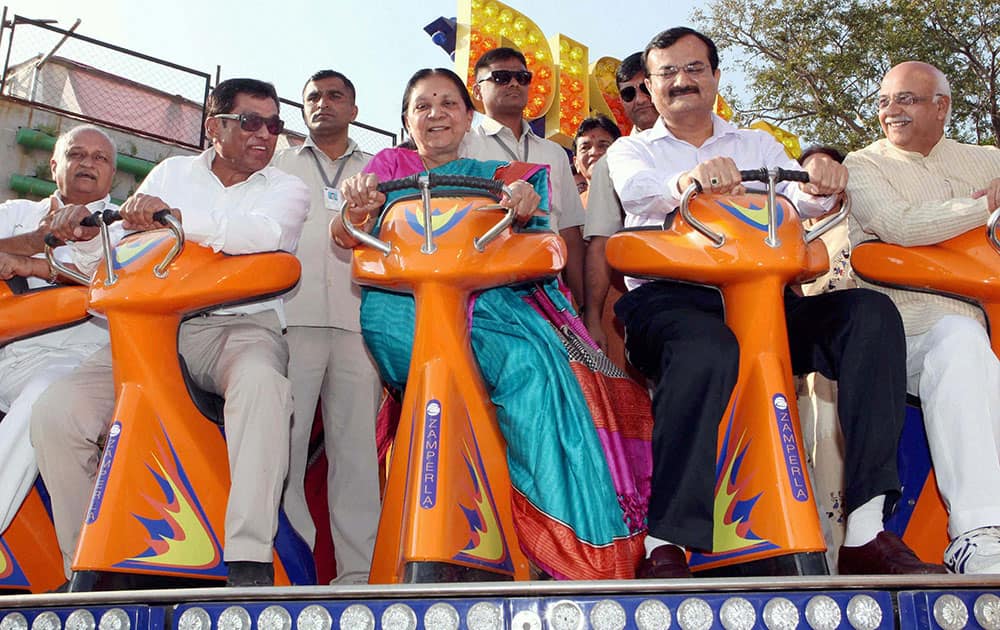 Gujarat Chief Minister Anandi Ben Patel enjoy ride during the inauguration of amusement park at Kankaria lake.