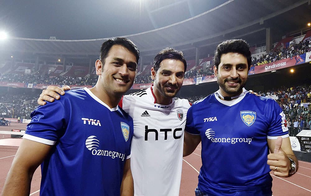 Chennaiyin FC co-owners MS Dhoni, Abhishek Bachchan and NorthEast United FC co-owner John Abraham share a light moment during the Indian Super League match between Chennaiyin FC and NorthEast United FC, in Chennai.