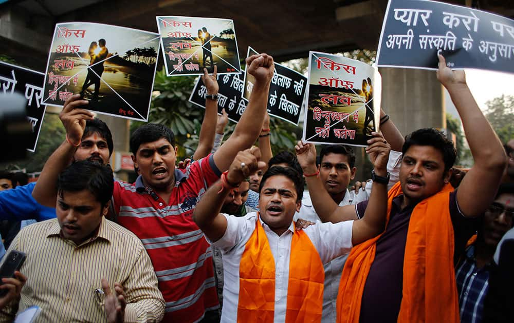 Members of various Hindu right-wing organizations shout slogans as they try to prevent activists participating in the 'Kiss of Love' campaign from approaching the headquarters of the right-wing Rashtriya Swayamsevak Sangh (RSS) in New Delhi.