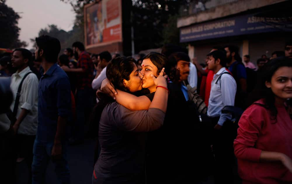 Indian women kiss each other to express support to the 'Kiss of Love' campaign near the Hindu right-wing Rashtriya Swayamsevak Sangh (RSS) headquarters in New Delhi.