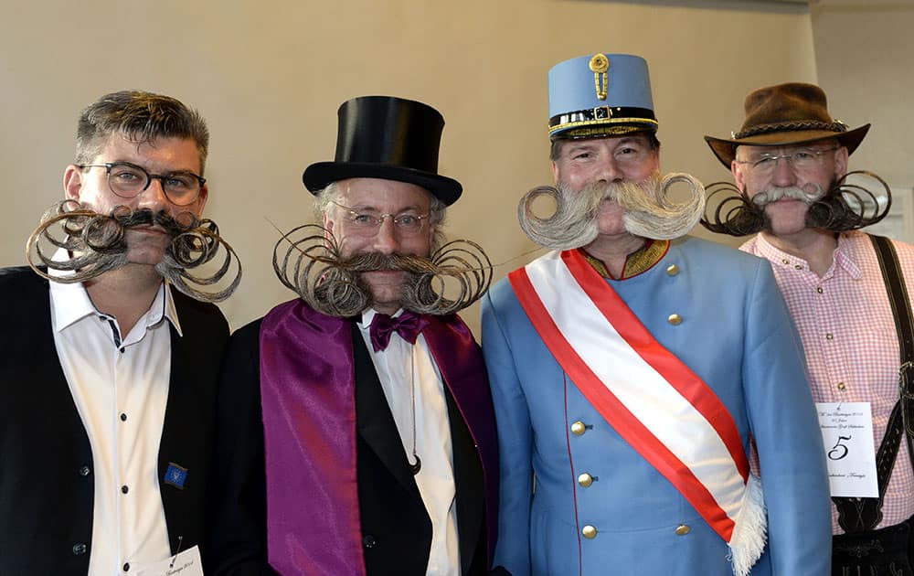 Diebolt Herve, Juergen Burkhardt, Franz Mitterhauser and Dieter Besuch, from left, pose before their appearance in the European Beard Championships in Schluchsee, Germany.