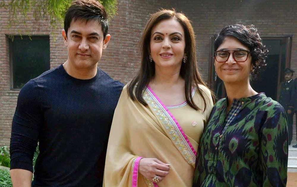 Nita Ambani with actor Aamir Khan and Kiran Rao in Agra on Sunday for a TV channel program.