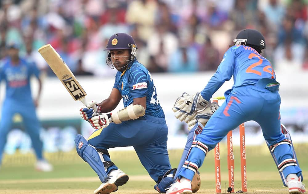 SriLanka’s Mahela Jayawardene plays a shot against India during 3rd ODI cricket match in Hyderabad.