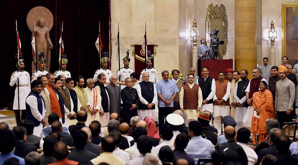 PRESIDENT PRANAB MUKHERJEE, VICE PRESIDENT HAMID ANSARI AND PRIME MINISTER NARENDRA MODI WITH THE NEWLY SWORN-IN MINISTERS AT THEIR OATH TAKING CEREMONY AT RASHTRAPATI BHAVAN IN NEW DELHI.