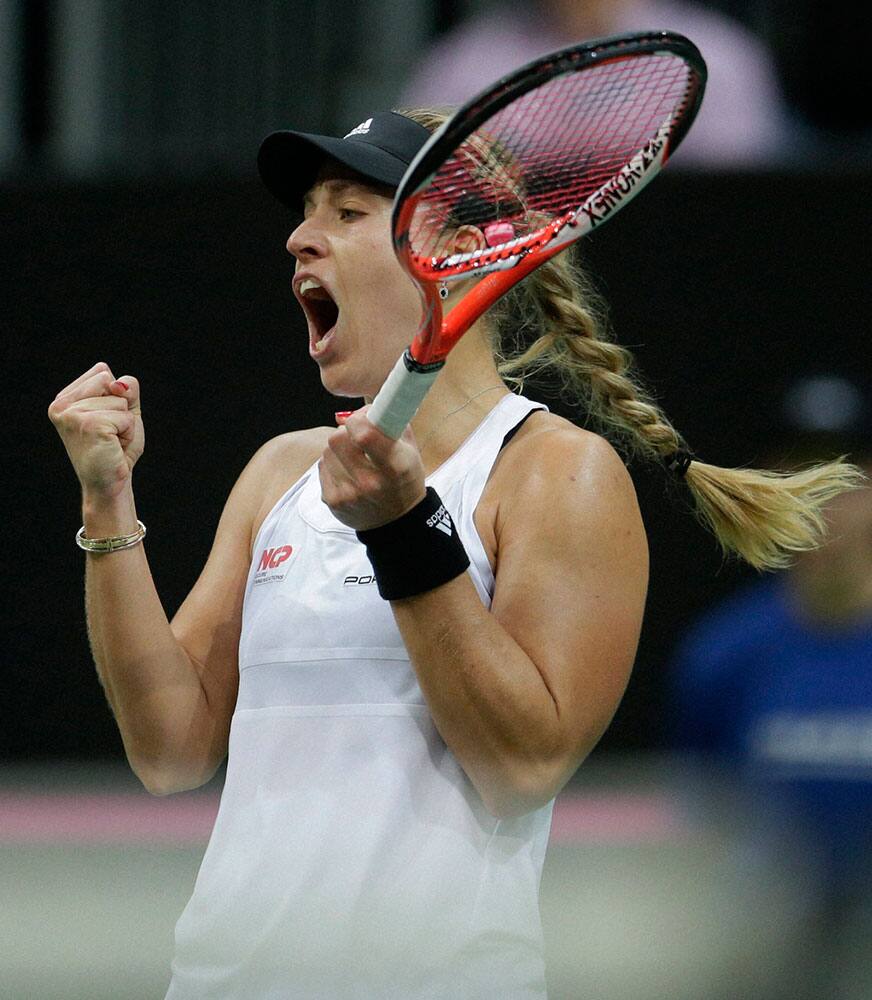 Germanys Angelique Kerber reacts after winning a point against Czech Republics Petra Kvitova during their Fed Cup Final tennis match between Czech Republic and Germany in Prague, Czech Republic.