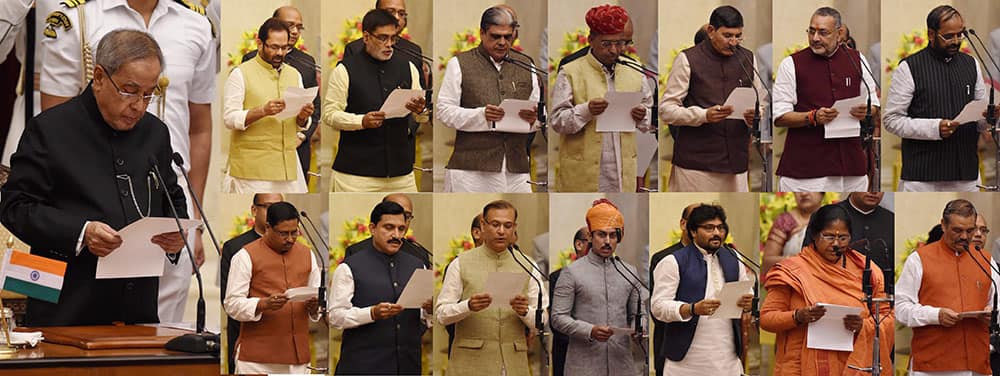  **COMBO** President Pranab Mukherjee administers oath to new Ministers of State Mukhtar Abbas Naqvi, Ram Kripal Yadav, Haribhai Parthibhai Chaudhary, Sanwar Lal Jat, Mohanbhai Kalyanjibhai Kundariya, Giriraj Singh, Hansraj Gangaram Ahir, Ram Shankar Katheria, Y.S. Chowdary, Jayant Sinha, Col. Rajyavardhan Singh Rathore, Babul Supriyo, Sadhvi Niranjan Jyoti and Vijay Sampla at the swearing-in ceremony at Rashtrapati Bhavan in New Delhi