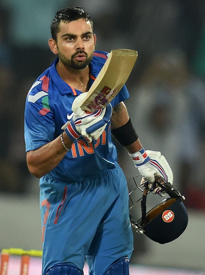 Indian captain Virat Kohli celebrates his fifty against Sri Lanka during 3rd ODI match at Hyderabad.