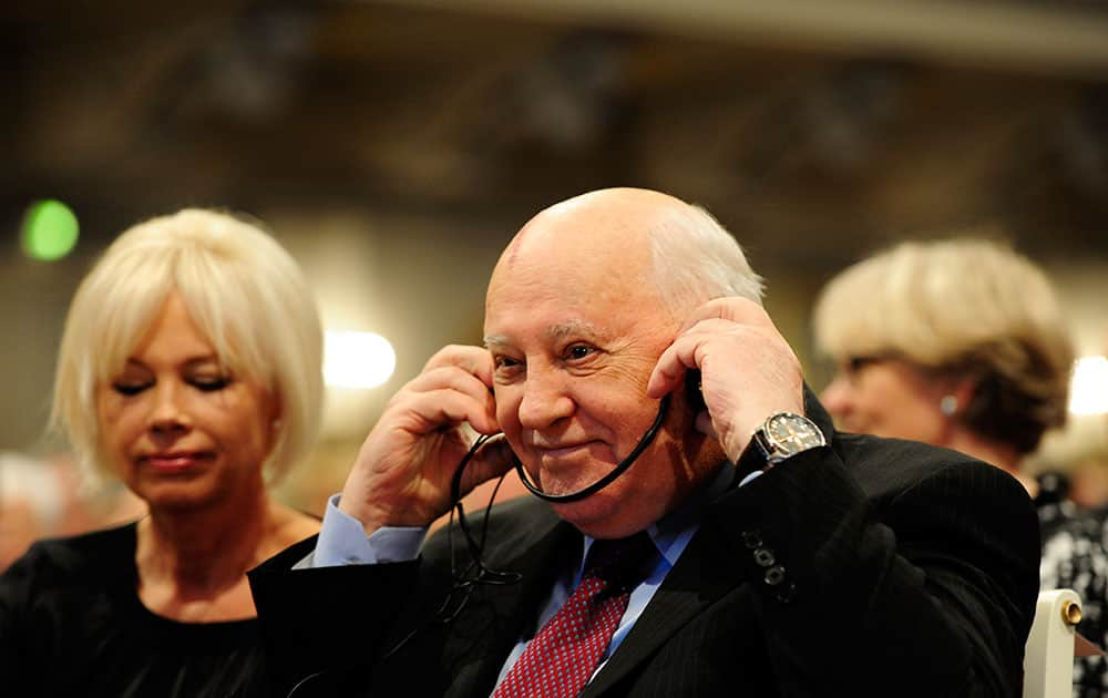 Former Soviet leader Mikhail Gorbachev, right, and his daughter Irina Mikhailovna Virganskaya, left, attend a ceremony to mark the 25th anniversary of the fall of the Berlin Wall in Berlin, Germany.