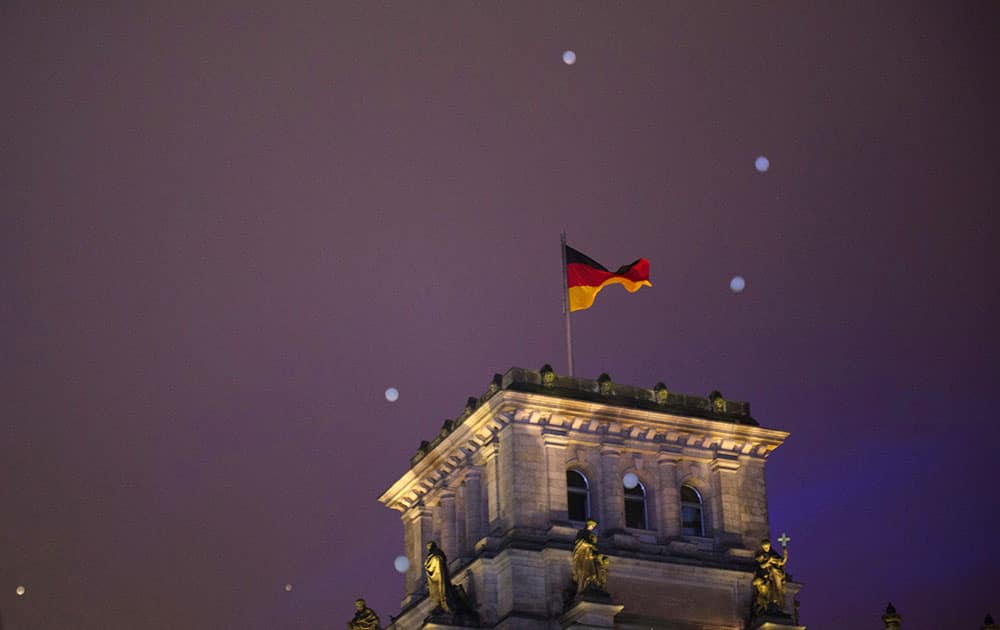 Balloons fly over the Reichstag during the central event to commemorate the Fall of the Wall in Berlin, Germany.