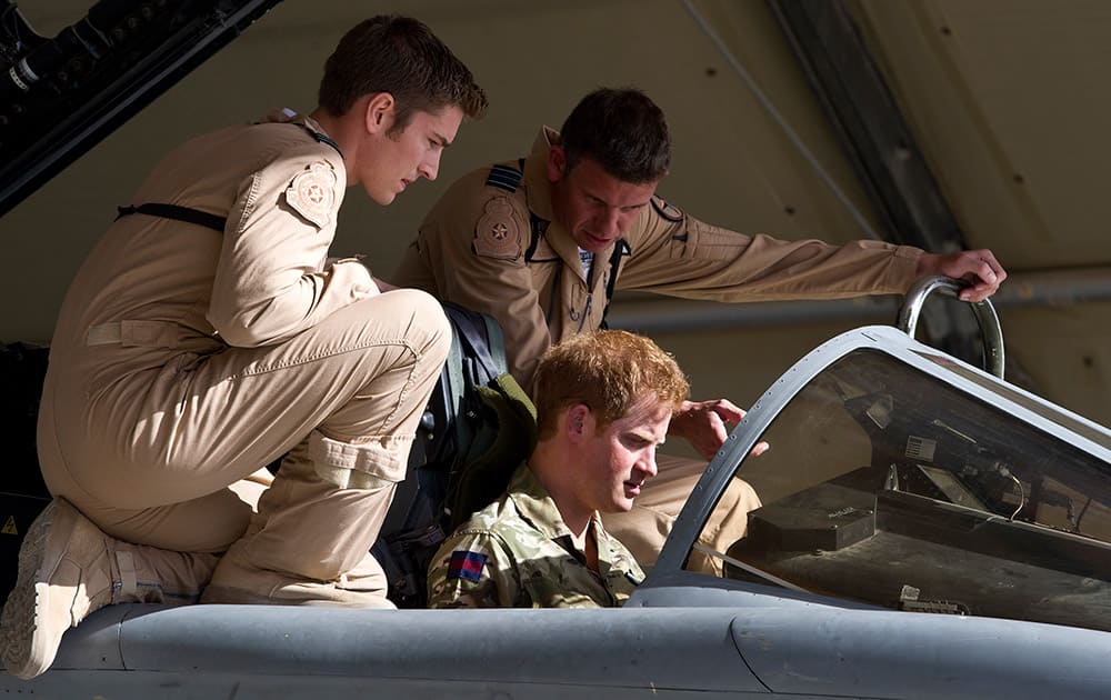 Britain's Prince Harry sits in the cockpit of a plane at Kandahar Air base, Afghanistan.