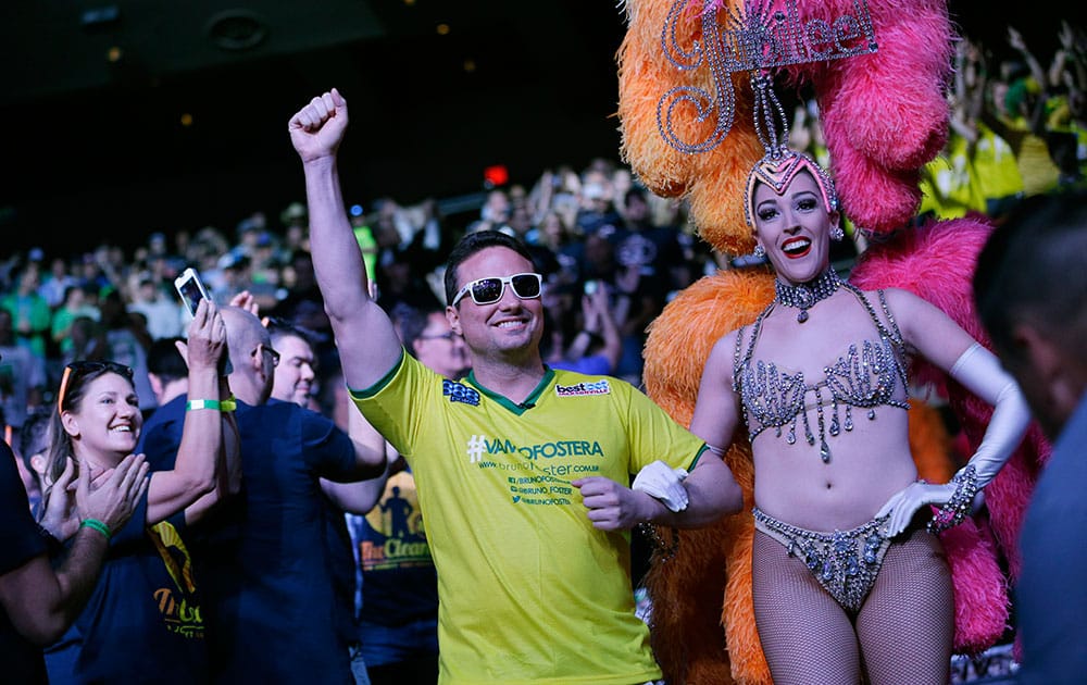 Competitor Bruno Politano of Fortaleza, Ceara, Brazil celebrates as he is walks into the theater before the start of the World Series of Poker Final Table in Las Vegas.