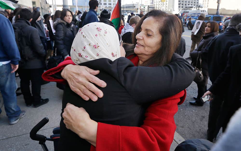 Rasmieh Yousef Odeh, 67, right, hugs a supporter outside federal court in Detroit, after the Palestinian immigrant was found guilty of immigration fraud for failing to disclose her conviction and imprisonment in a Jerusalem supermarket bombing that killed two people.
