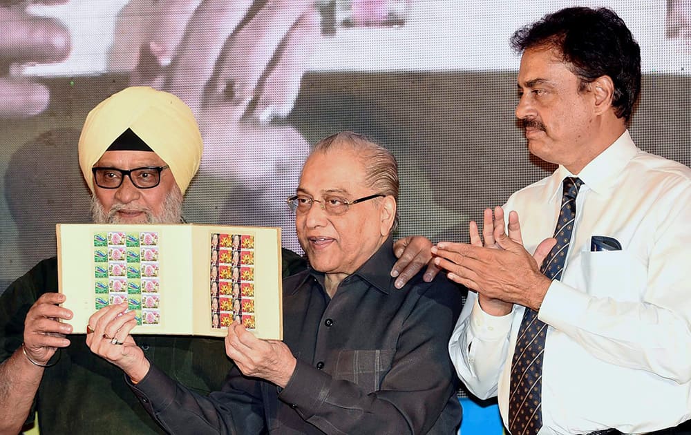 CAB President Jagmohan Dalmiya (C), Former cricketers Dilip Vengsarkar (R) and Bishan Singh Bedi release the stamps during 150th year celebration of Eden Gardens in Kolkata.