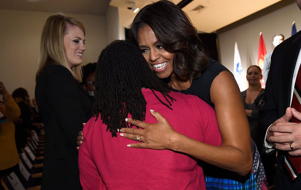 First lady Michelle Obama greets people after speaking at the Women Veterans Career Development Forum at the Women in Military Service for America Memorial (WIMSA) at Arlington National Cemetery in Arlington, Va.