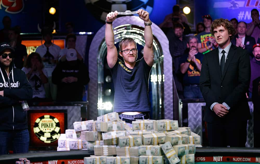 Martin Jacobson holds up the World Series of Poker main event bracelet after winning the tournament and its $10 million prize in Las Vegas. 