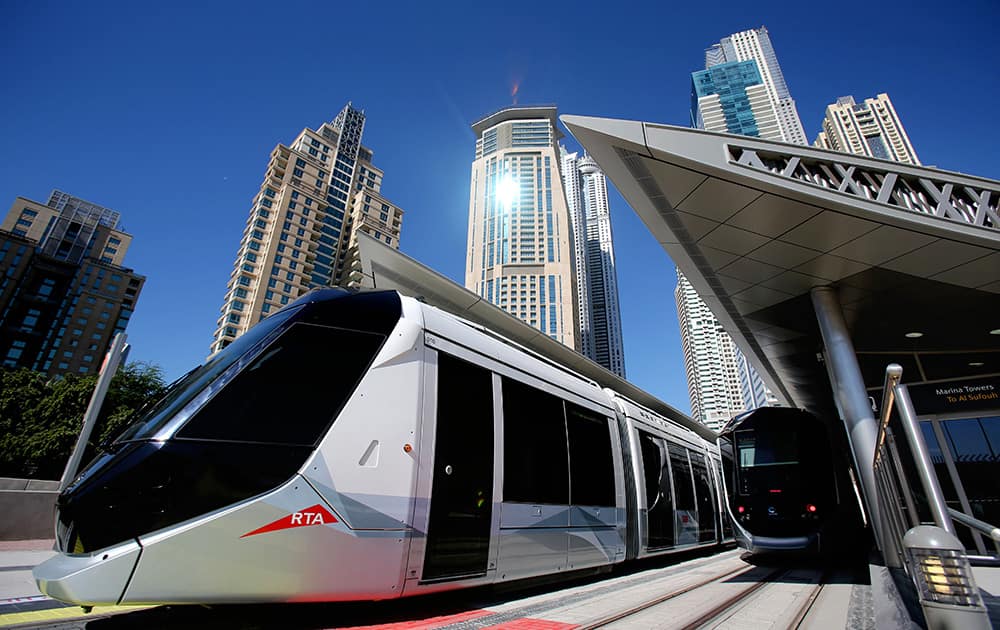 A tram leaves Marina Towers station during the first day of operation in Dubai, United Arab Emirates. The Mideast commercial hub of Dubai opened its first tram line on Wednesday, enticing would-be riders with air-conditioned platforms and a premium section on its sleek cars for those willing to spend a few more dirhams. 