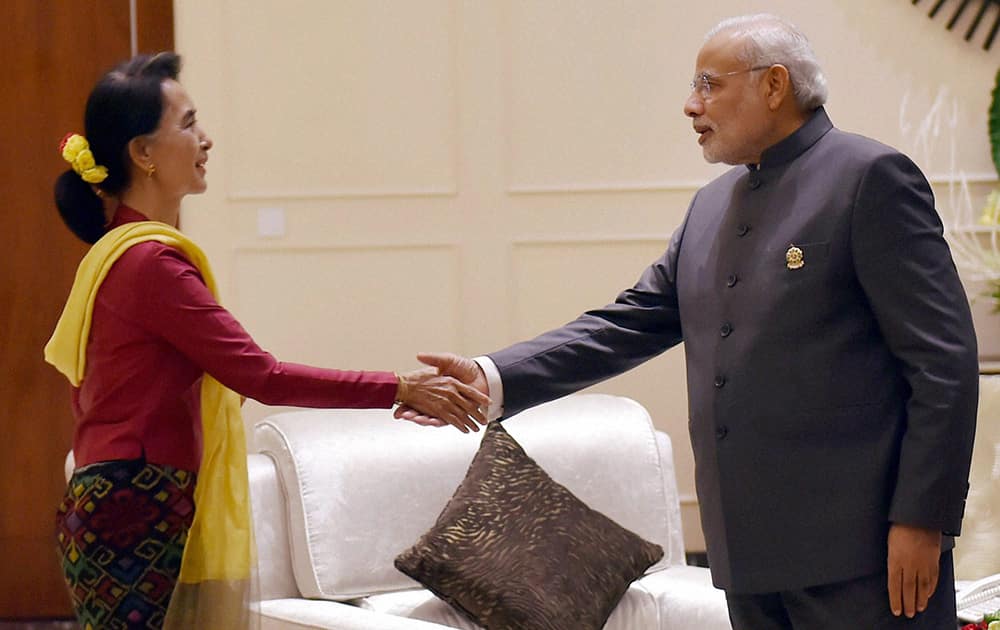 Prime Minister Narendra Modi shakes hands with Chairperson and General Secretary of the National League for Democracy, Aung San Suu Kyi during a meeting at Nay Pyi Taw in Myanmar.