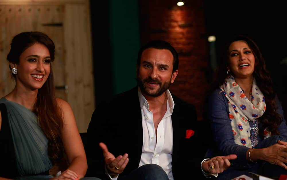 Saif Ali Khan speaks with the media, flanked by Sonali Bendre and Ileana D'Cruz during a promotional event for their film 'Happy Ending' in Mumbai.