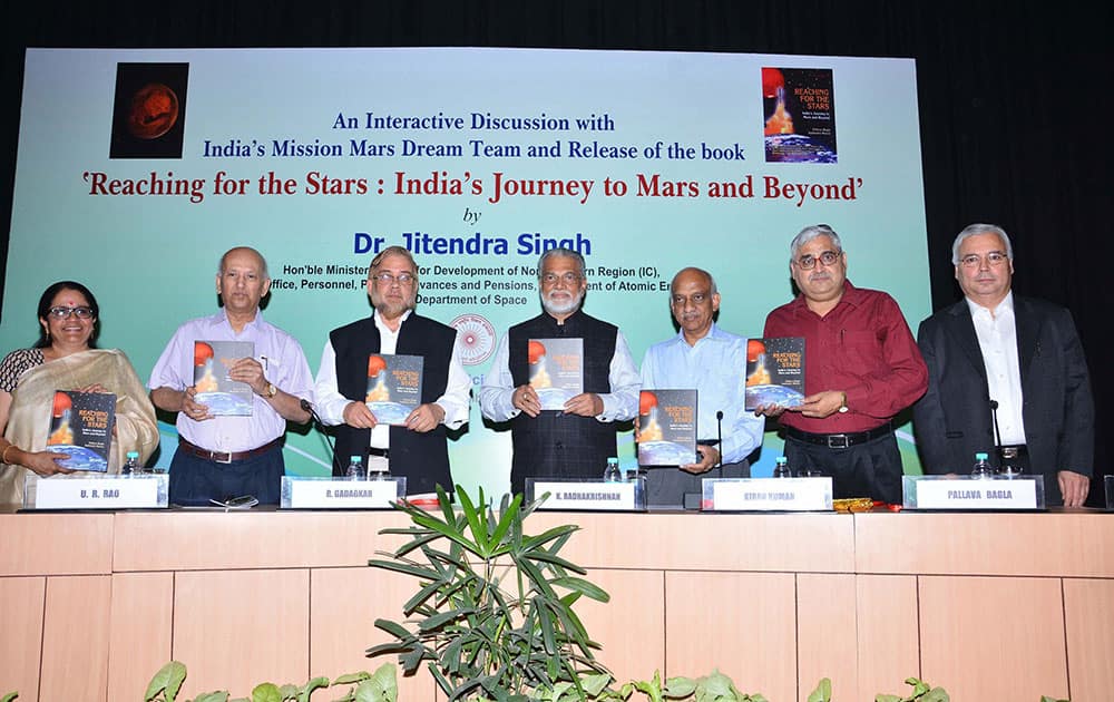  ISRO, Chairman, K Radhakrishnan, U R Rao, former chairman ISRO along with Mangalyaan team members releasing a book Reaching for the Stars: Indias Journey to Mars and Beyond written by Pallava Bagla (2nd R) at the Indian National Science Academy in New Delhi .