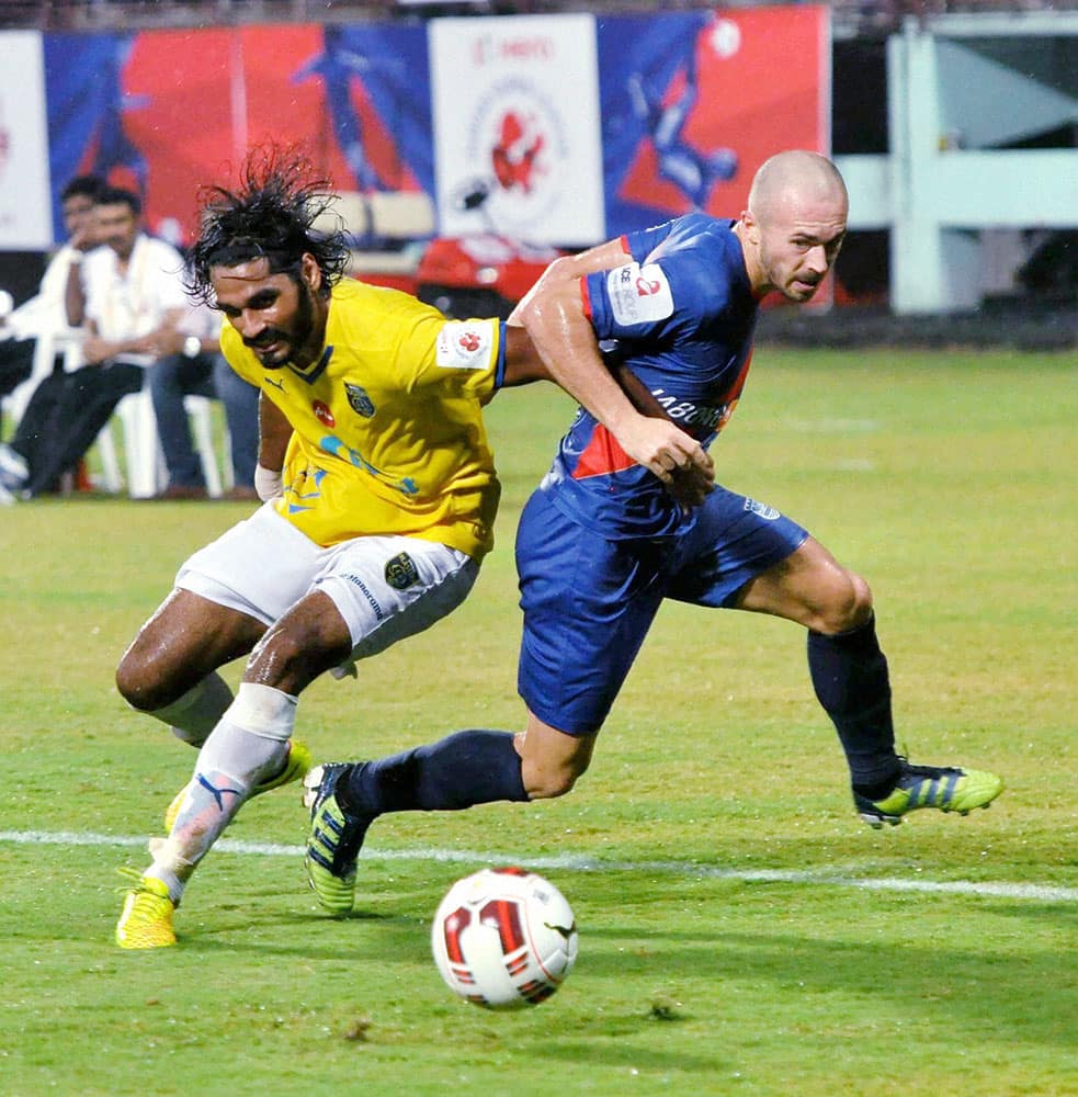 Kerala blasters FC (Yellow) and Mumbai City FC (Blue) players in action during the ISL match in Kochi.