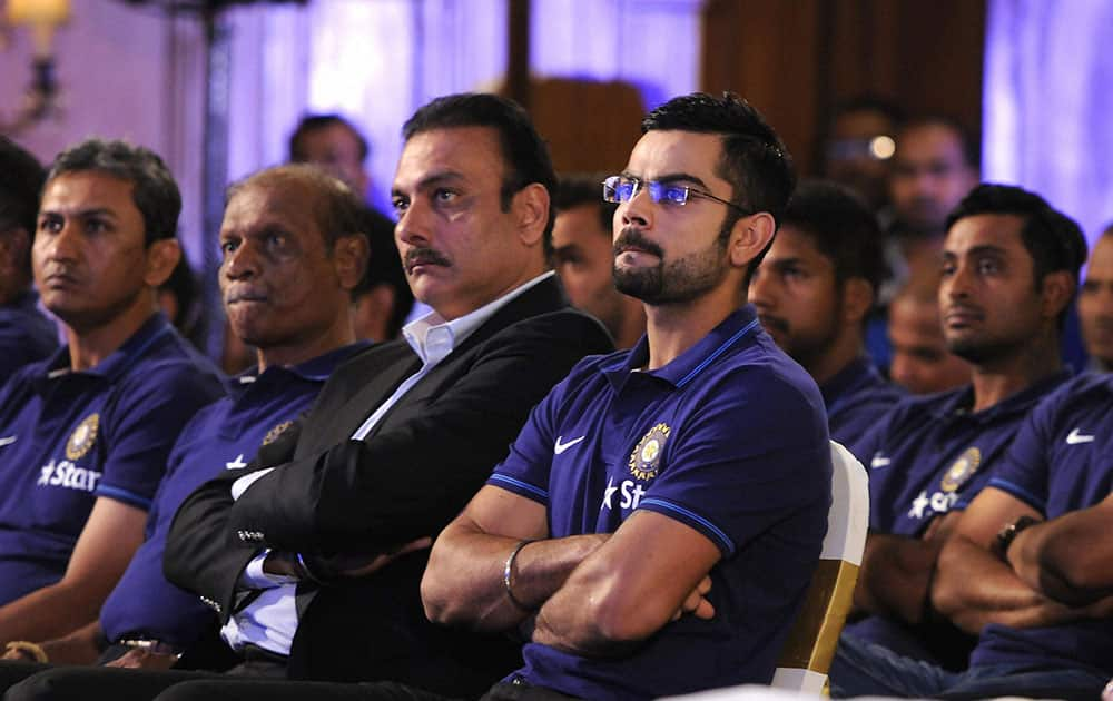 Indias captain Virat Kohli along with teammates and officials listen to VVS Laxman former Indian cricketer as the latter delievers a lecture during the 3rd annual Pataudi-Memorial-Lecture in Kolkata.