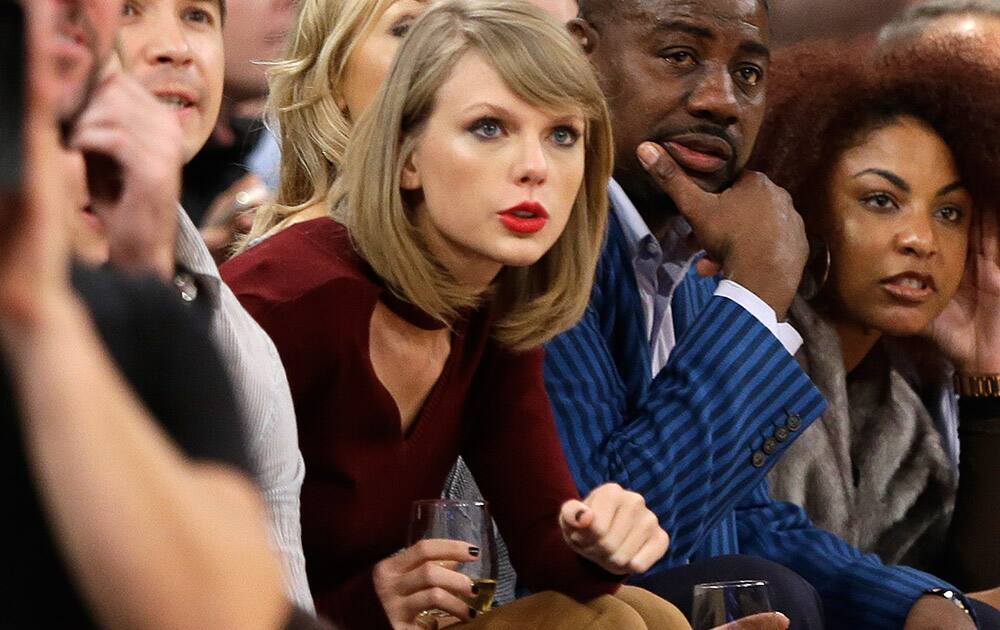 Taylor Swift reacts during the second half of an NBA basketball game between the New York Knicks and the Orlando Magic  in New York. 