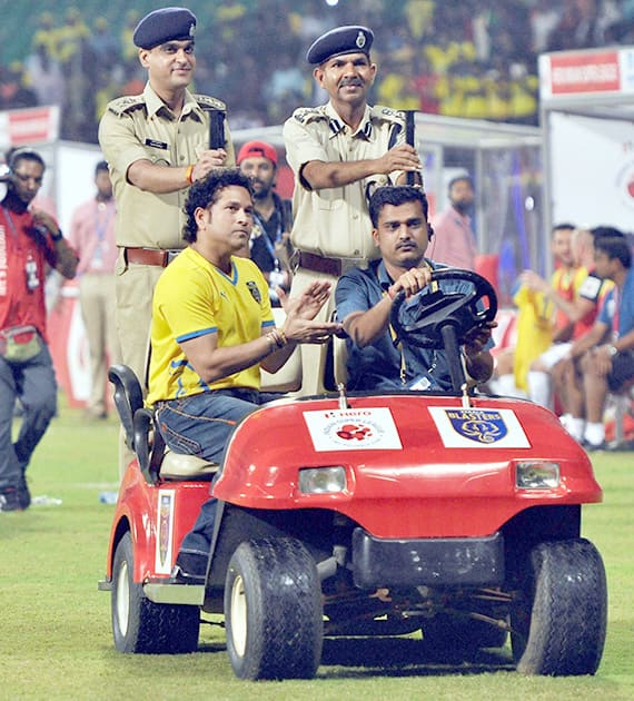 Cricket legend and Kerala Blasters FC co-owner Sachin Tendulkar as a token of appreciation honored two CISF personnel, Tarun Kumar and M.L. Chauhan, before the start of an ISL match between Kerala Blasters and Mumbai City, in Kochi.