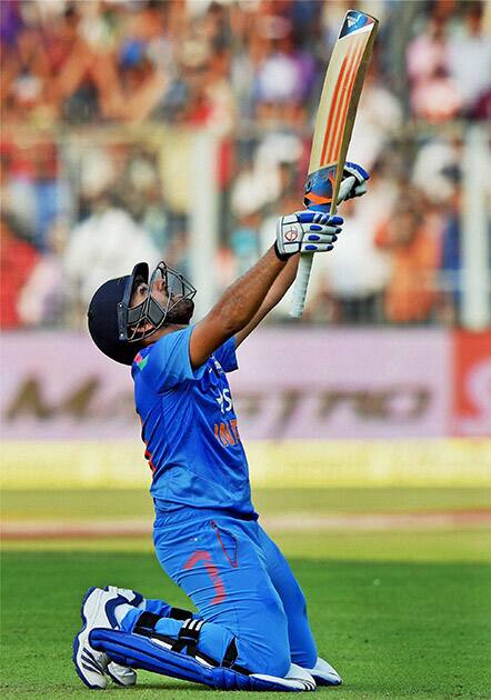 Rohit Sharma celebrates his century during 4th ODI cricket match against Sri Lanka at Eden Garden in Kolkata.