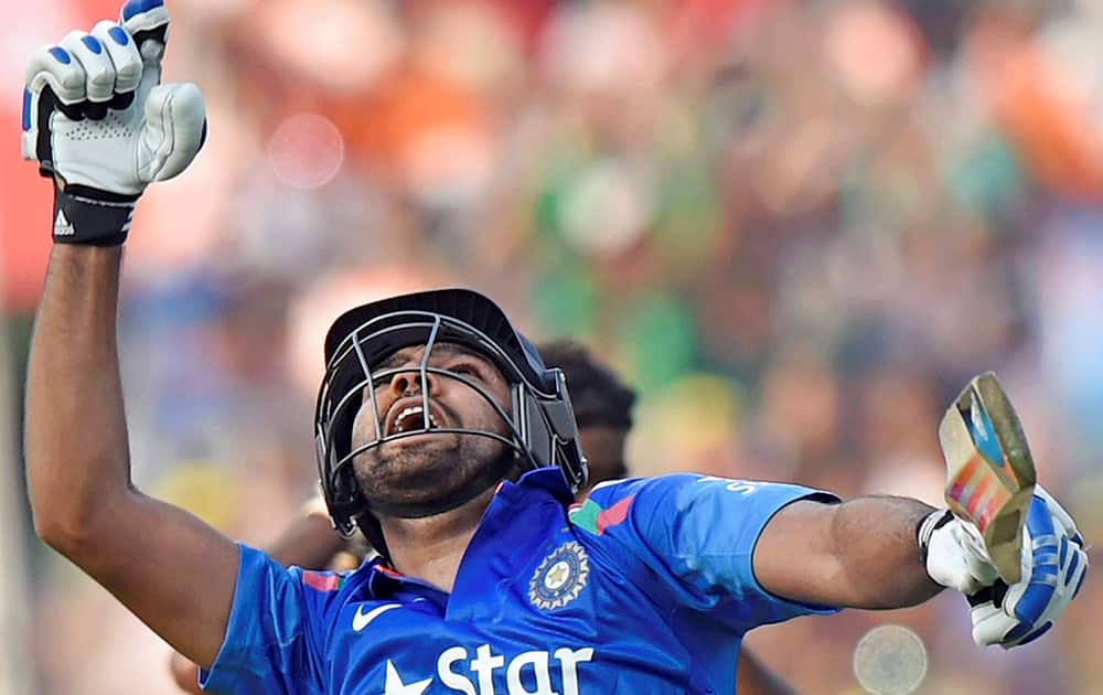 Rohit Sharma rejoices after completing his double century during the 4th ODI match against Sri Lanka at Eden Garden in Kolkata.