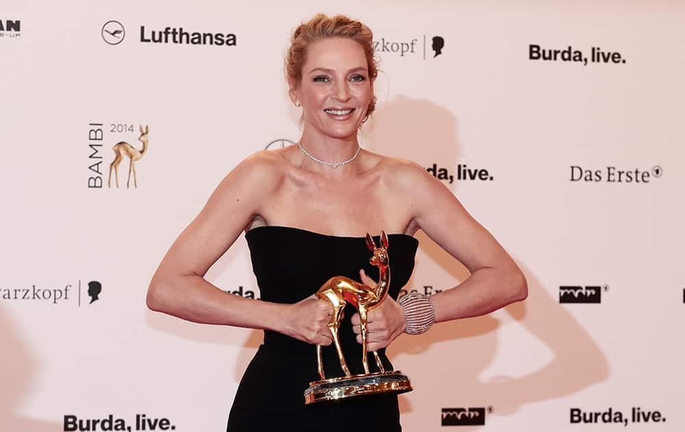 US actress Uma Thurman presents her 'Actress International' Bambi 2014 media award at the awarding event in Berlin, Germany.