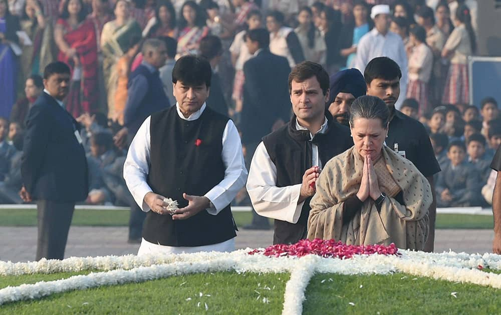 Congress President Sonia Gandhi along with party Vice President Rahul Gandhi paying homage to Pt Jawaharlal Nehru on his 125th birth anniversary at Shanti Van in New Delhi.