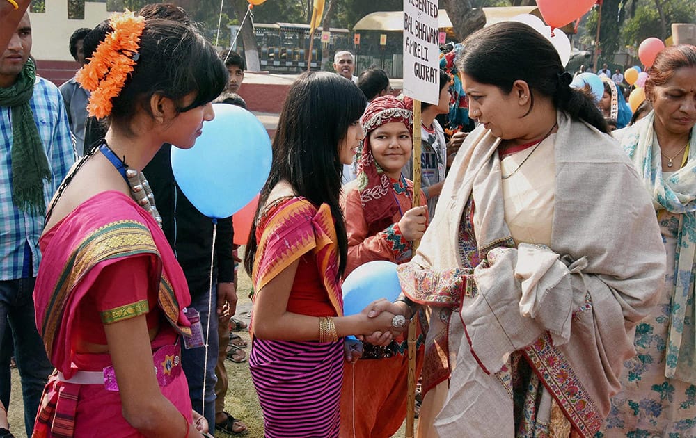 HRD Minister Smriti Irani interacts with children during Bal Diwas celebrations at Bal Bhavan.