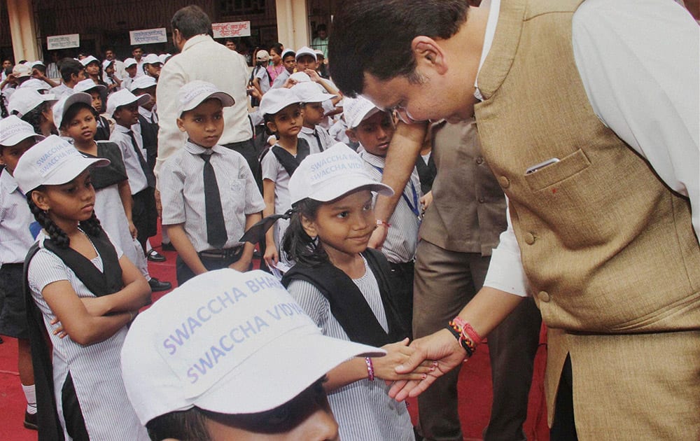 CM Devendra Fadnavis during Swacchata Abhiyaan event during Childrens Day celebrations at a school in Mumbai.