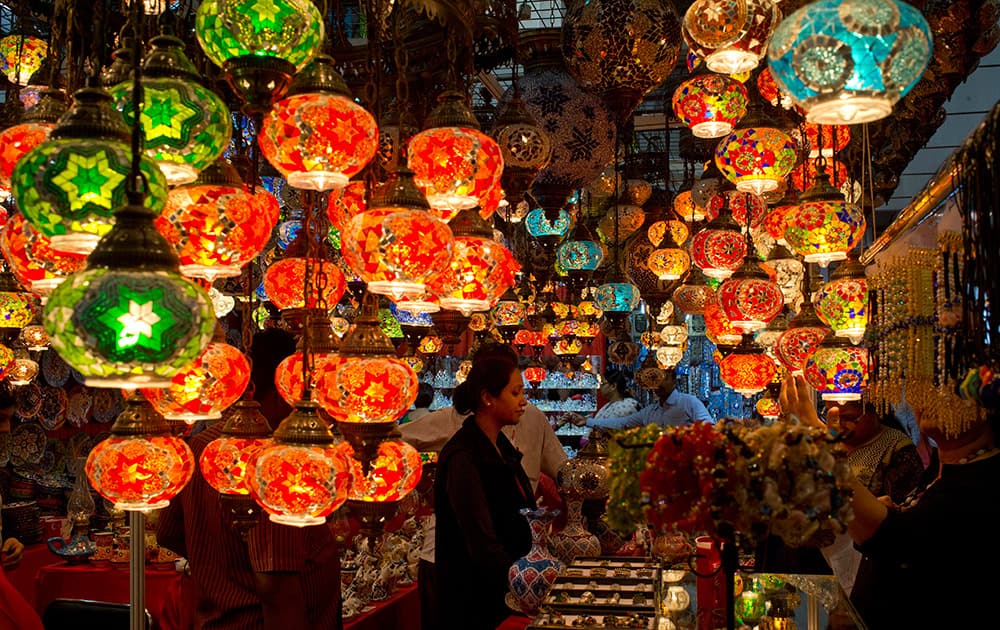 Lamps hang inside a Turkish stall selling various artifacts at the India International Trade Fair in New Delhi.