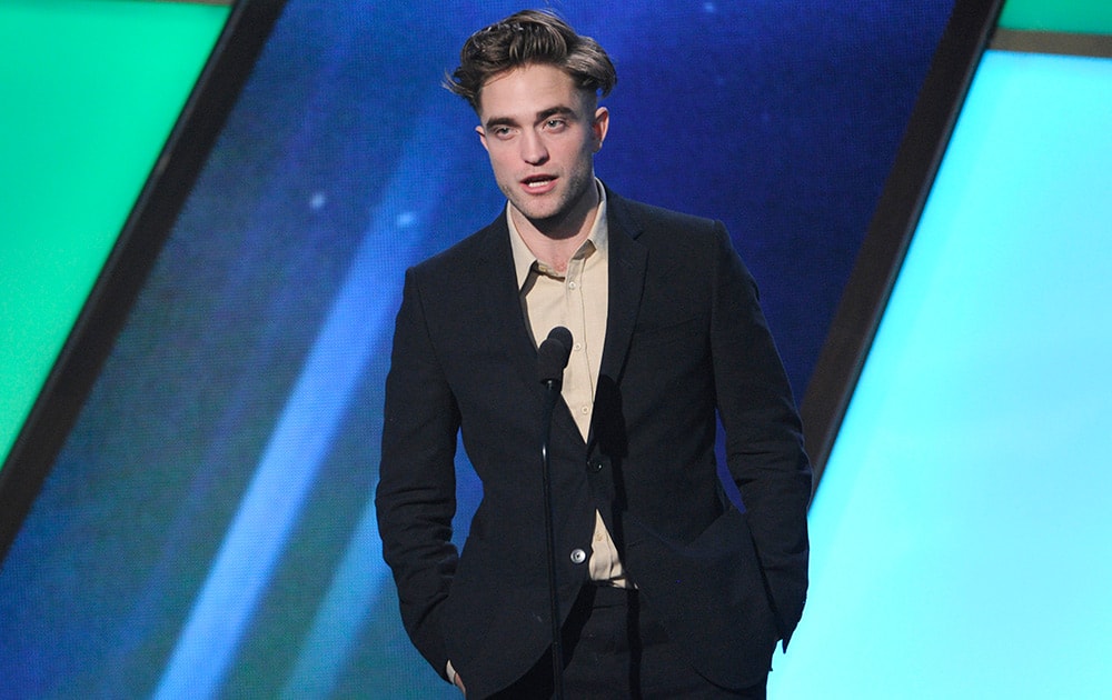 Robert Pattinson speaks on stage at the Hollywood Film Awards at the Palladium in Los Angeles.