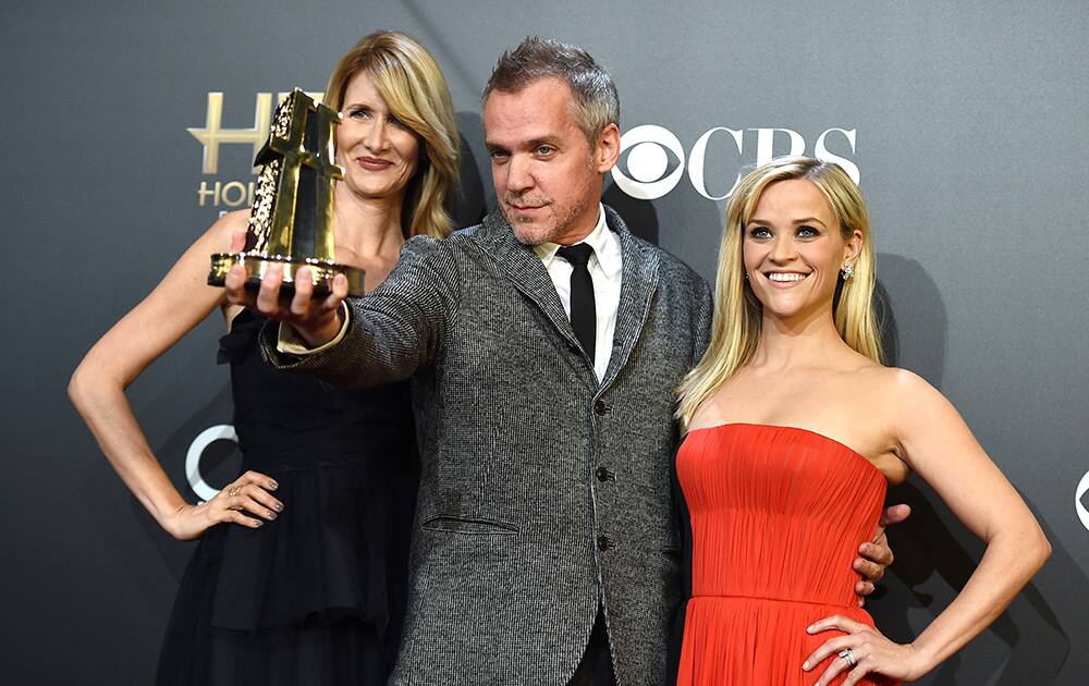 Jean-Marc Vallee, center, winner of the Hollywood breakthrough director award, Laura Dern, left, and Reese Witherspoon pose in the press room at the Hollywood Film Awards at the Palladium in Los Angeles.