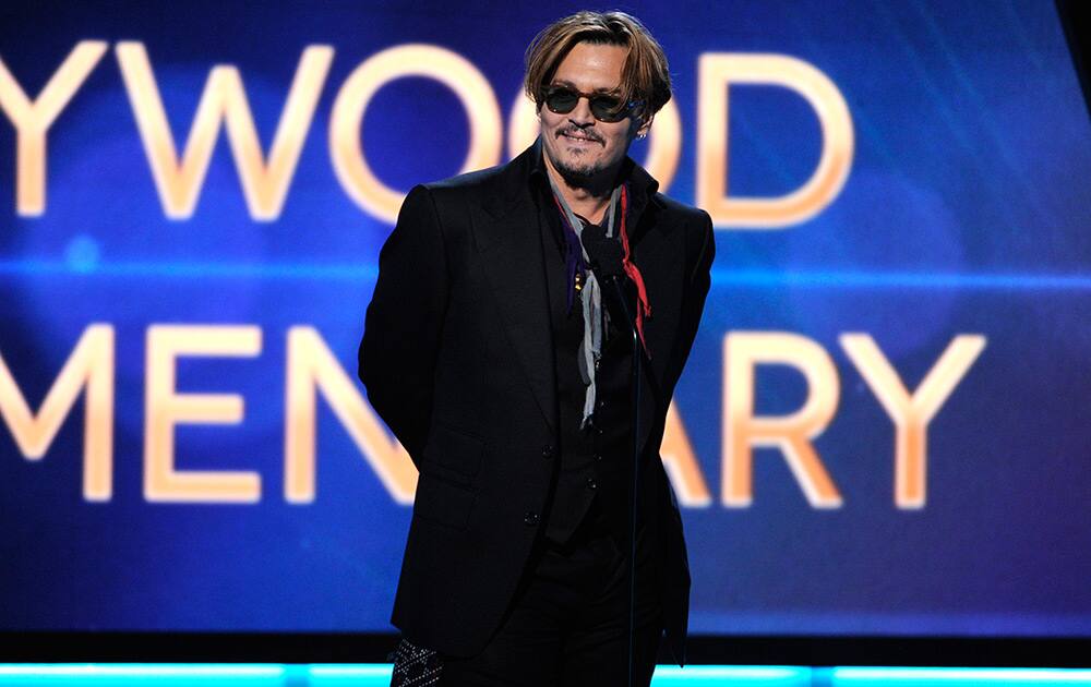 Johnny Depp presents the Hollywood documentary award on stage at the Hollywood Film Awards at the Palladium in Los Angeles. 