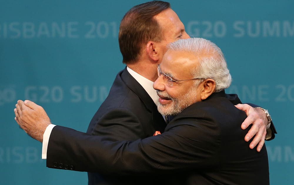Prime Minister of Australia Tony Abbott welcomes Prime Minister of India Narendra Modi to the G-20 summit in Brisbane, Australia.