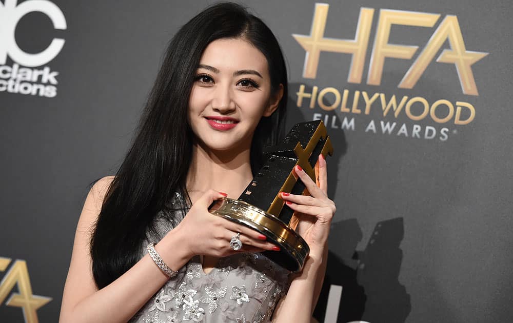 Tian Jing poses in the press room with the Hollywood international award at the Hollywood Film Awards at the Palladium in Los Angeles. 