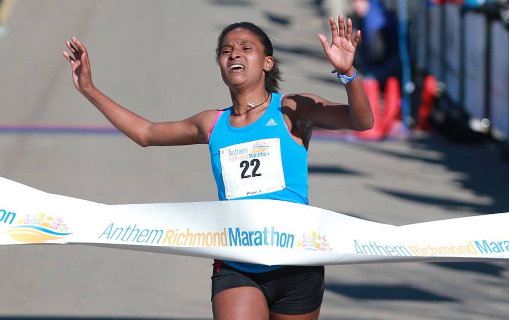 Ethiopa's Waynishet Abebe wins women's division of the Richmond Marathon in Richmond, Va.